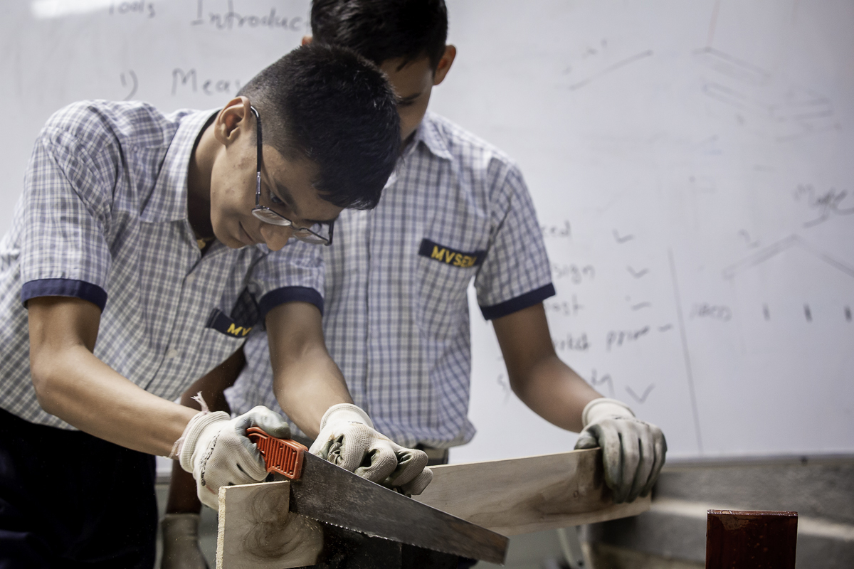 Students learning food processing and baking techniques